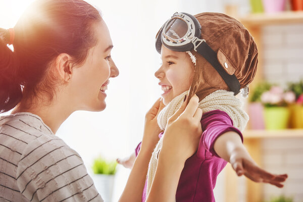 Mother and child girl playing