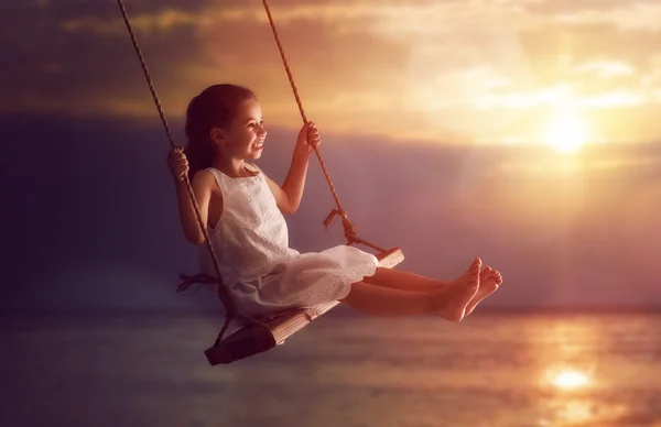 Child girl on swing — Stock Photo, Image