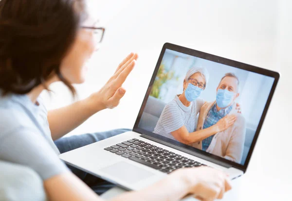 Senior Couple Wearing Face Masks Using Remote Talking Coronavirus Flu — Stock Photo, Image