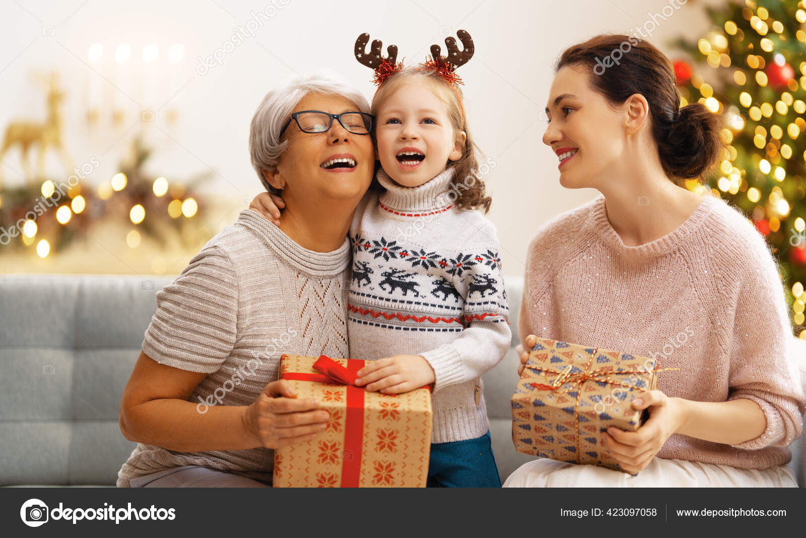 Merry Christmas Happy Holidays Cheerful Kids Presenting Gifts Mom Granny  Stock Photo by ©choreograph 523580328
