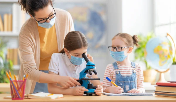 Back School Happy Children Wearing Facemasks Sitting Desks Girls Teacher — Stock Photo, Image