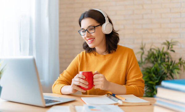 Happy casual beautiful woman working in home office. 