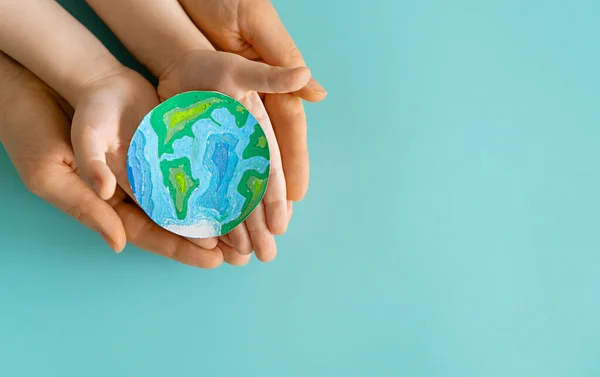 Child Adult Holding Planet Hands Teal Background Earth Day Holiday — Fotografia de Stock