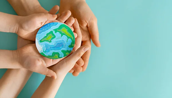 Children Adult Holding Planet Hands Teal Background Earth Day Holiday — Stok fotoğraf