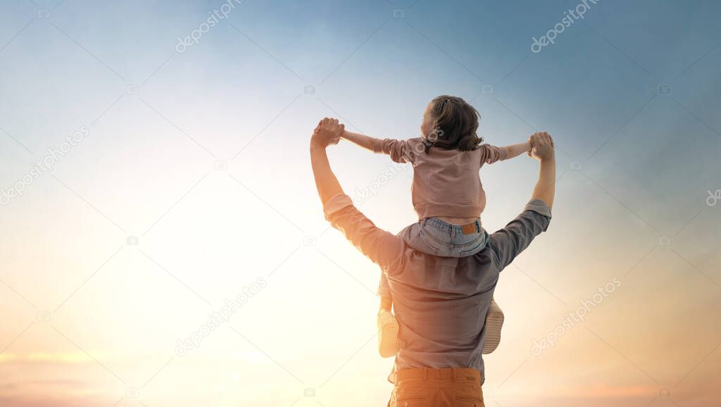 Happy loving family. Father and his daughter child playing and hugging outdoors. Cute little girl and daddy