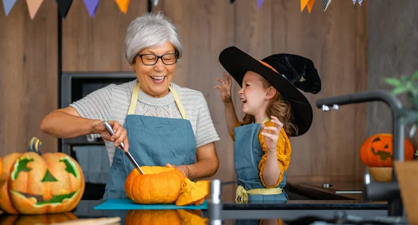 Happy Family Preparing Halloween Grandmother Granddaughter Carving Pumpkins Home — Stock Photo, Image