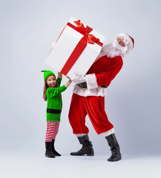 Jultomten och barn — Stockfoto