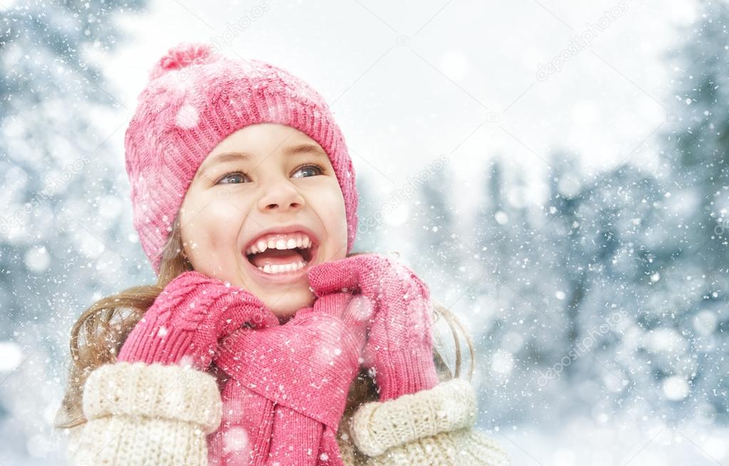 girl playing on a winter walk