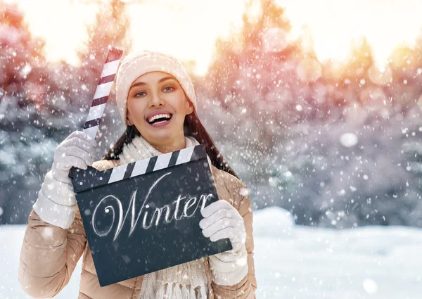 Woman holding clapper board — Stock Photo, Image