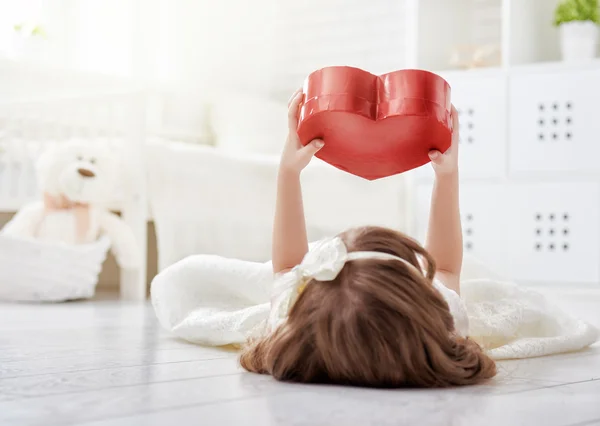 Girl with red heart — Stock Photo, Image