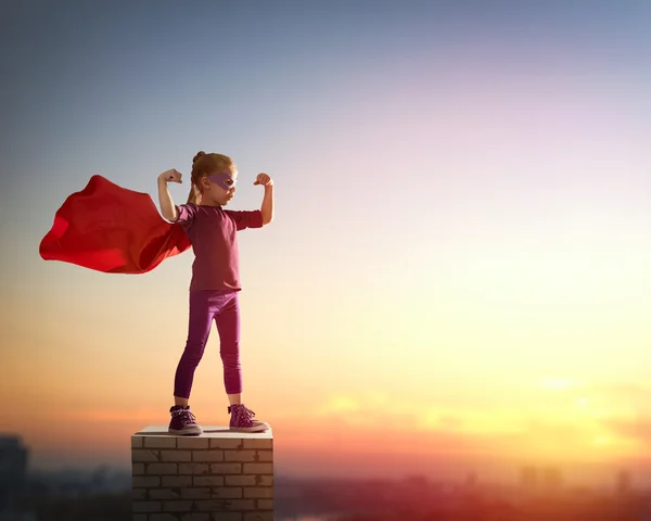 Girl plays superhero — Stock Photo, Image