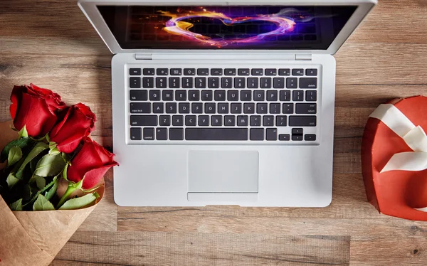 Laptop on wooden table — Stock Photo, Image