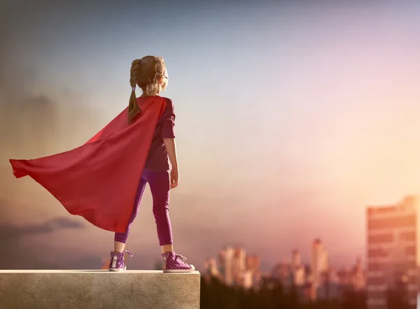 Girl plays superhero — Stock Photo, Image