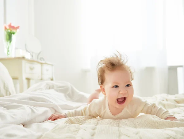 Baby girl on the bed — Stock Photo, Image