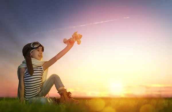 Child playing with toy airplane — Stock Photo, Image