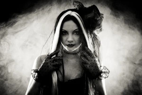 Portrait gothic girl in style clothes, shot over smoky backgroun — Stock Photo, Image