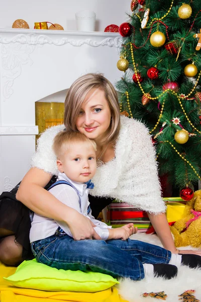 Happy mother and two her children in Christmas — Stock Photo, Image