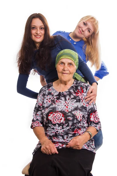 Grandmother both two granddaughters positive and happy, isolated Stock Photo