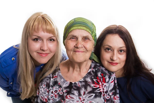 Grandmother both two granddaughters positive and happy, isolated Stock Picture