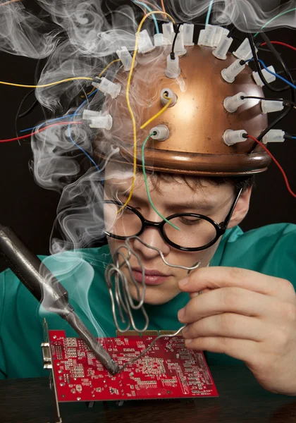 Inventor with soldering iron — Stock Photo, Image