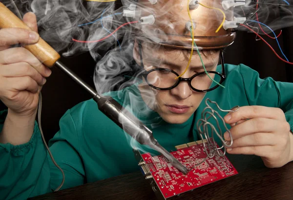 Inventor with soldering iron — Stock Photo, Image