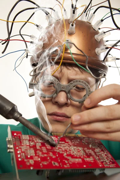 Crazy inventor replacement of electronic components — Stock Photo, Image
