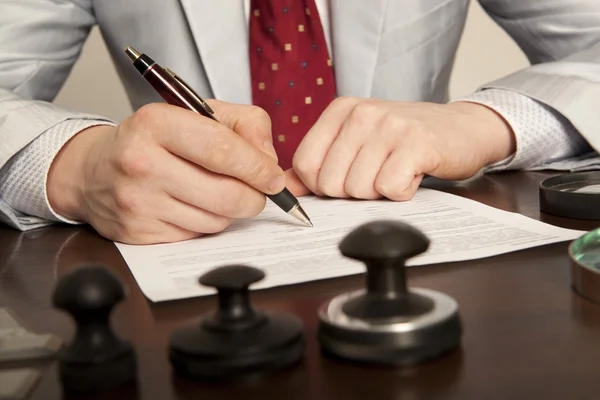 Notary signs the documents from our office — Stock Photo, Image