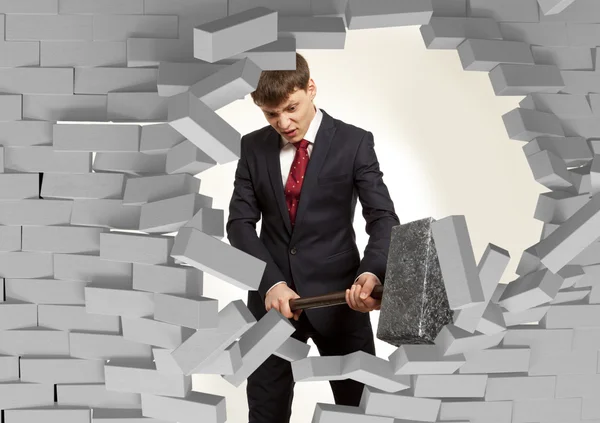 Businessman with hammer in hands — Stock Photo, Image