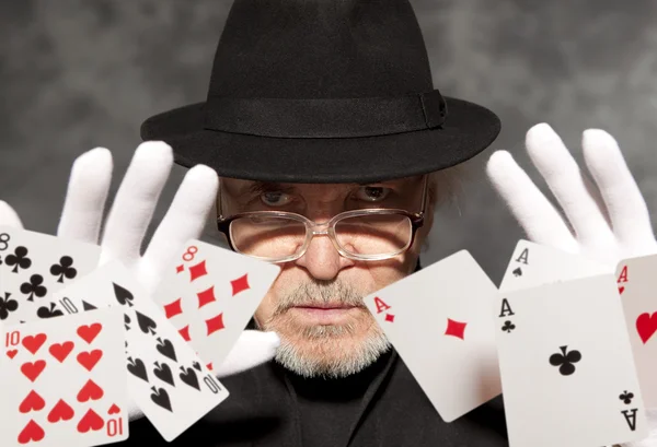 Magician show with playing cards. — Stock Photo, Image