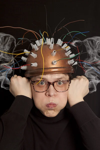 Cheerful inventor helmet for brain research Royalty Free Stock Photos