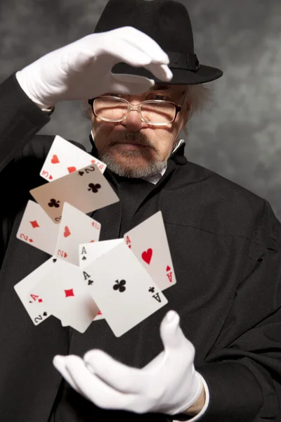 Magician show with playing cards. — Stock Photo, Image