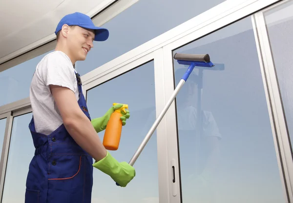 Professional man washes window