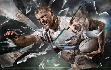 Rugby player in action on shards of broken glass background clipart