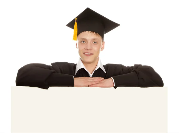 Graduado espreitando atrás do painel em branco — Fotografia de Stock