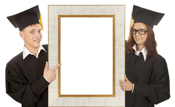 Afgestudeerde staande achter frame — Stockfoto