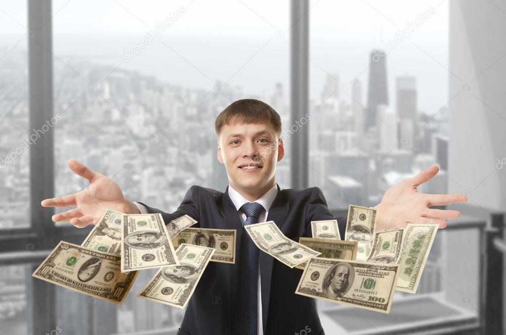 businessman throwing dollar