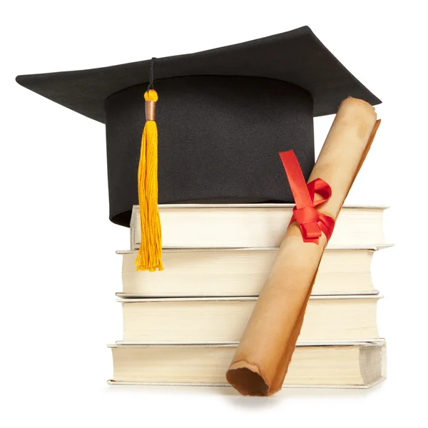 Graduation hat and diploma — Stock Photo, Image