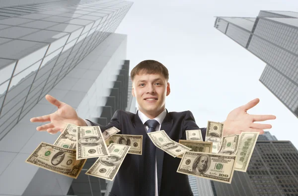 Businessman throwing dollar — Stock Photo, Image