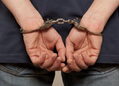 Prisoner locked in handcuffs clipart
