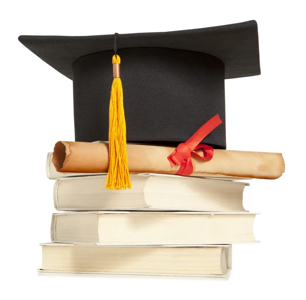 Graduation hat and diploma — Stock Photo, Image