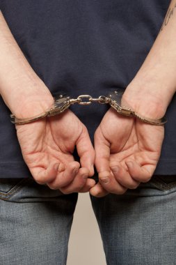 Prisoner locked in handcuffs clipart