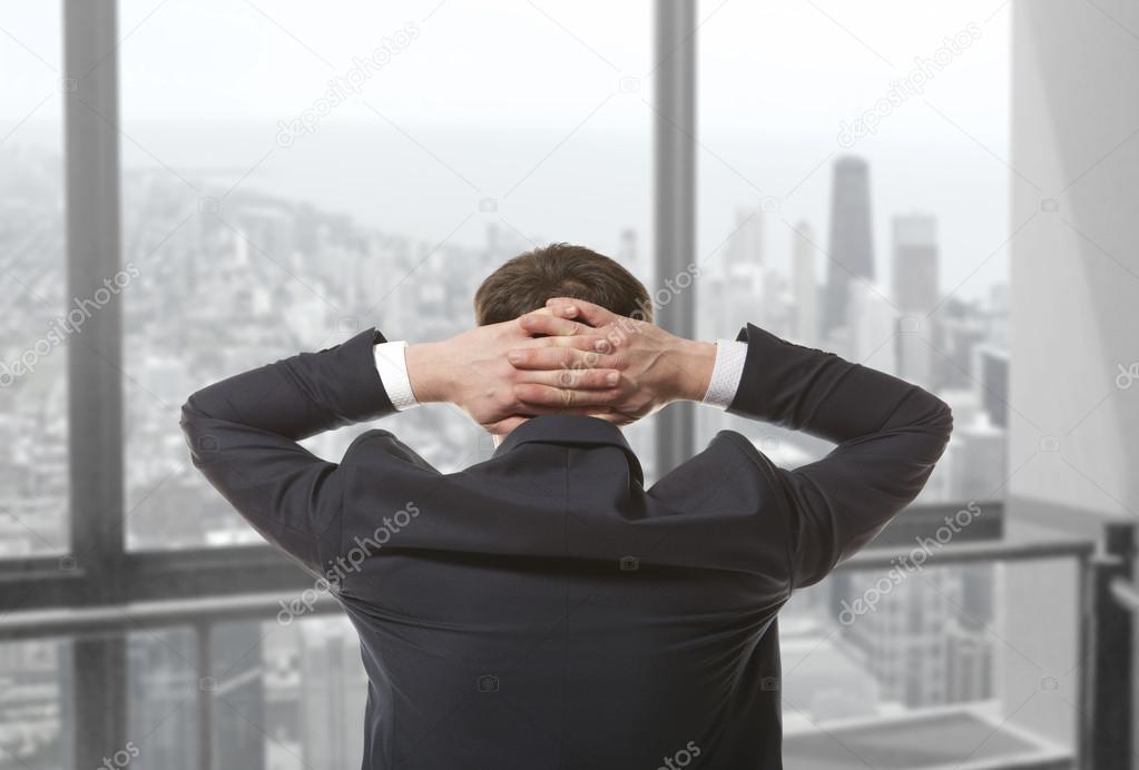 Businessman looking out window