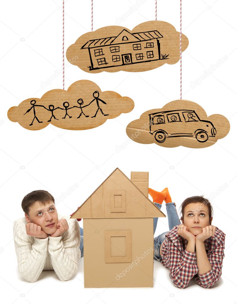 Couple with house of cardboard