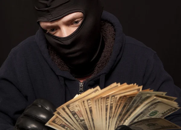 Thief and cash — Stock Photo, Image