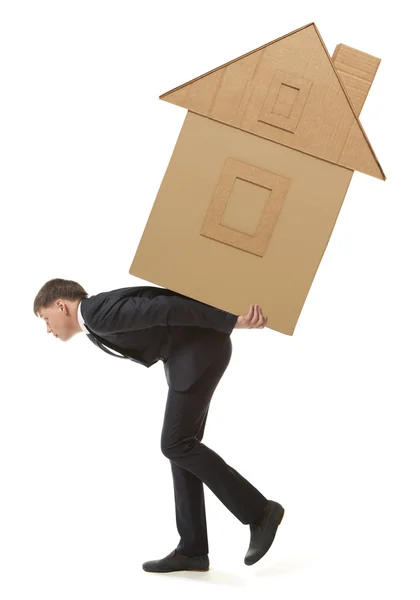 Businessman lifting paper house — Stock Photo, Image