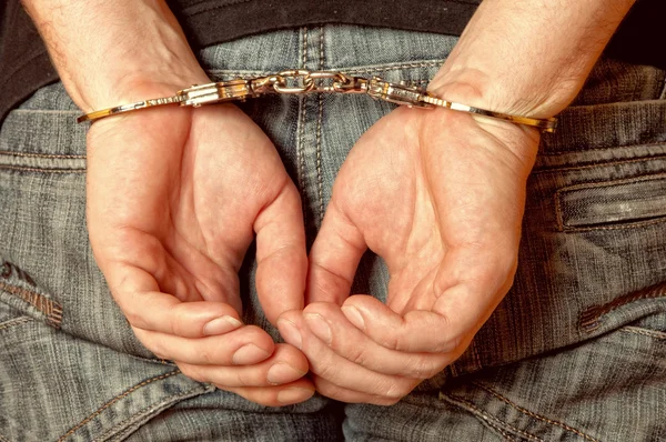 Man handcuffed hands at back — Stock Photo, Image