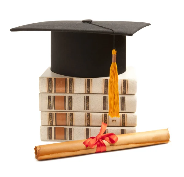 Graduation hat and diploma — Stock Photo, Image