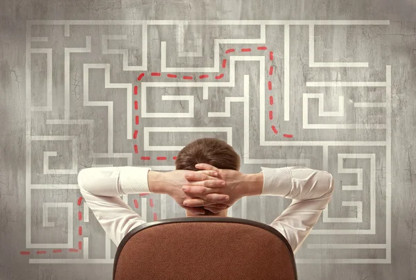 Businessman looking at a maze — Stock Photo, Image