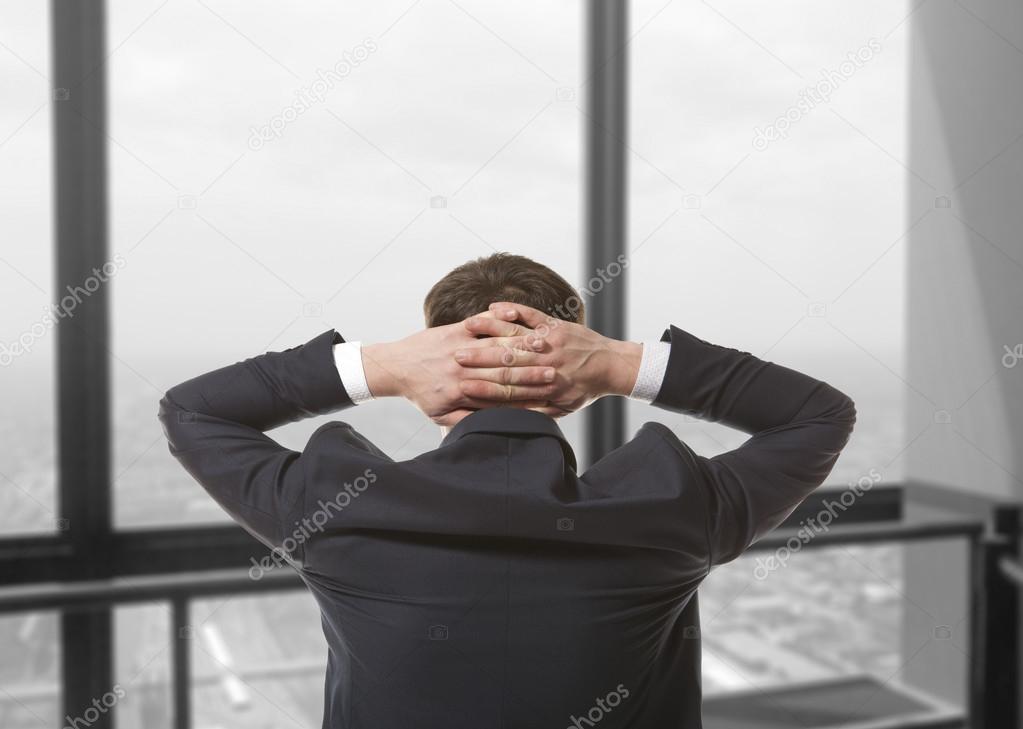 Businessman looking out window