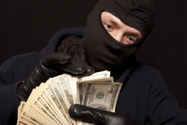 Thief and cash — Stock Photo, Image
